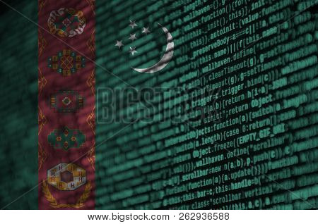 Turkmenistan Flag  Is Depicted On The Screen With The Program Code. The Concept Of Modern Technology
