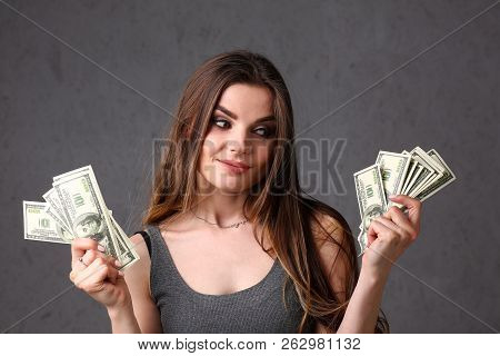 Beautiful European Woman Portrait. Scattering Money Notes Dollars In Fashion Vows Style  Curly Hair 