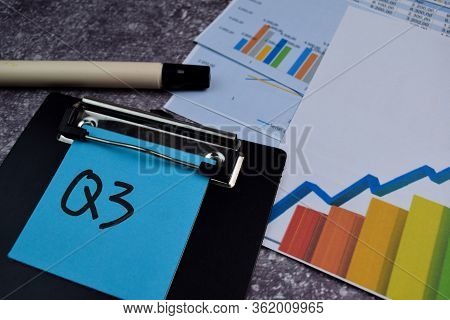 Q2 - 3rd Quarter Period Write On Sticky Notes Isolated On Office Desk. Stock Market Concept