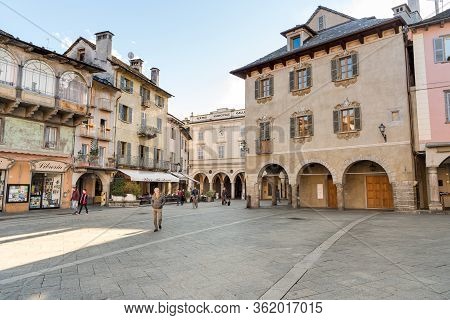 Domodossola, Piedmont, Italy - November 11, 2016: Pedestrian Street With Typical Outdoor Bars And Sh