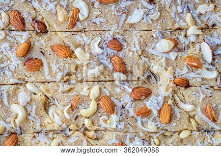 Closeup Of Homemade Semolona Sweets Well Deocrated With Almond, Cashew And Coconut Rub Toppings. Als