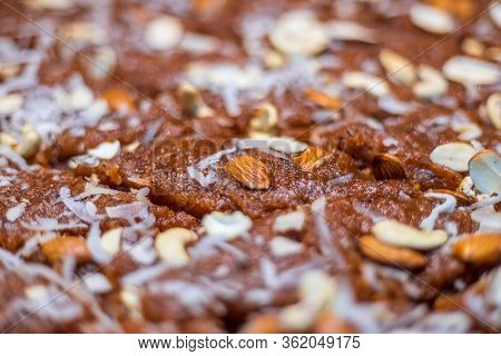 Closeup Of Homemade Semolona Sweets Well Deocrated With Almond, Cashew And Coconut Rub Toppings. Als