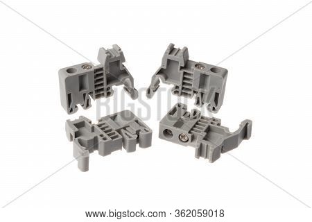 Set Of Grey Stopper Block For Electrical Pass Through Terminals For Din Rail, Isolated On White Back