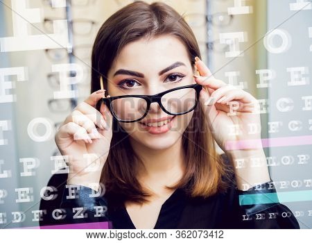 Young Girl With Glasses On The Light Background.