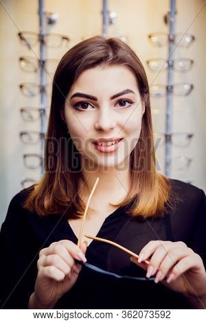 Young Girl With Glasses On The Light Background.