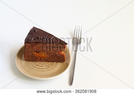 Chocolate Austrian Cake Sacher Sliced On White Table Background. Sacher Cake Slice. Traditional Aust