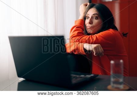 Upset Woman Watching A Program On Her Laptop