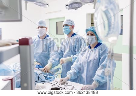 Arthroscope Surgery. Orthopedic Surgeons In Teamwork In The Operating Room