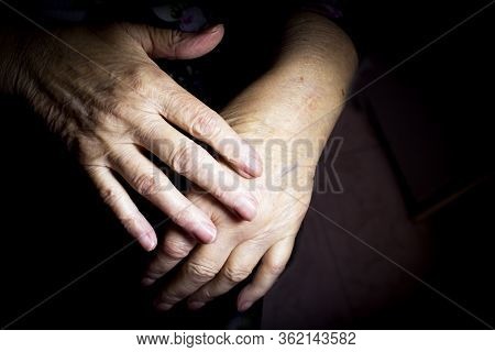 Hands Of Elderly Woman Doing A Selfmassage. Manual Physiotherapy