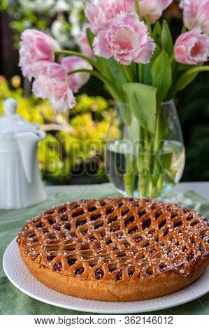 Cherry Pie With Dough Lattice From Limburg, Netherlands Served In Sunny Garden