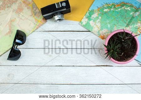 The Concept Of Travel And Recreation. Amera, Maps Geographic, Passport, Money, Bag, Glasses, Sunscre