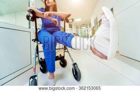 Patient On Rollator With Hand Brakes Moving In Hospital
