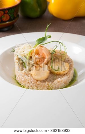 Scallops And Shrimps Served With Brown Rice