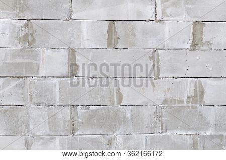 Brick Wall Made Of Foam Concrete Blocks. Concrete Block Wall Seamless Background And Texture