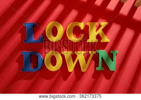 shadow on the word lock down on the red background