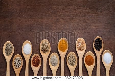 Various Spices In Wooden Spoon On Wood Table Background, Sugar, Pepper, Salt, Turmeric, Rosemary, Or