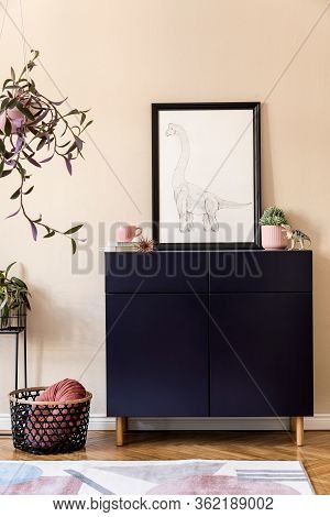 Stylish Interior Of Living Room With Black Mock Up Poster Frame, Plants, Blue Navy Commode, Decorati