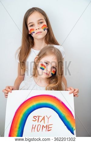 Two Kid Girls With Blond Hair Drew A Rainbow And A Poster Stay Home. Flashmob Chasetherainbow.