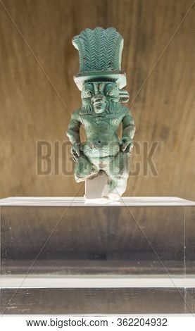 Barcelona, Spain - Dec 27th, 2019: God Bes Depiction In Faience With Incised Decoration. Puig Des Mo