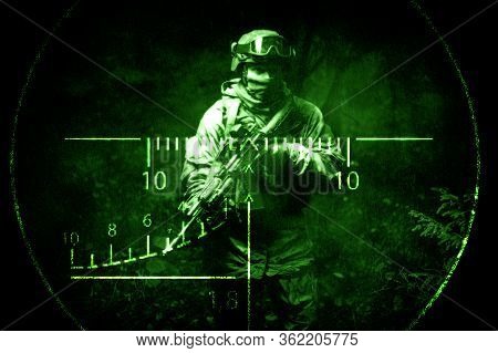 Portrait Of A Commando In The Night Sight Of A Sniper Rifle. The Concept Of Military Operations, Int