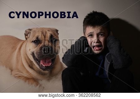 Scared Little Boy Suffering From Cynophobia On Beige Background. Irrational Fear Of Dogs