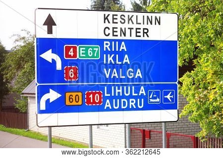 Parnu, Estonia - August 31, 2018: Road Sign With Diections To Kesklinn District Of Tallinn , Riga, I