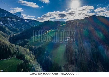 Aerial View Of Huge Valley Of The Mountains Of Italy, Trentino, Green Meadows, Slopes With Green Spr