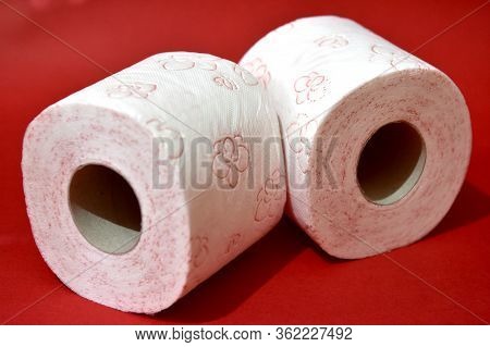 Roll Of Toilet Paper On Red Background