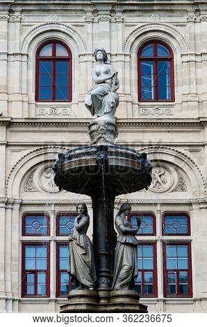 Vienna Opera House (wiener Staatsoper) In Austria, Detail Of The Facade And Of The Fountains Outside
