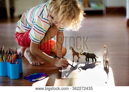 Child Shadow Drawing Animals. Kids Play At Home. Fun Crafts For Kindergarten Children. Little Boy Pa