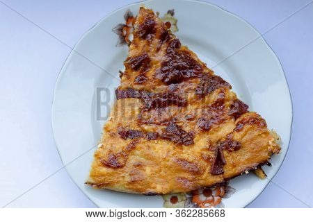 A Slice Of Delicious Pizza With Vegetables, Ham, Cheese And  Kashkaval  In Plate, Sofia, Bulgaria, E
