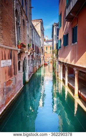 Venice canal view with historical buildings.