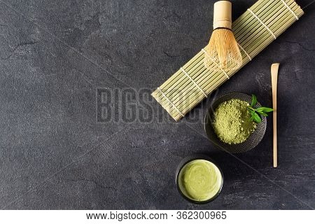 Green Matcha Tea Drink And Tea Accessories On Black Background Top View. Japanese Tea Ceremony Conce
