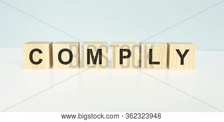Comply Word Written On Building Blocks Concept