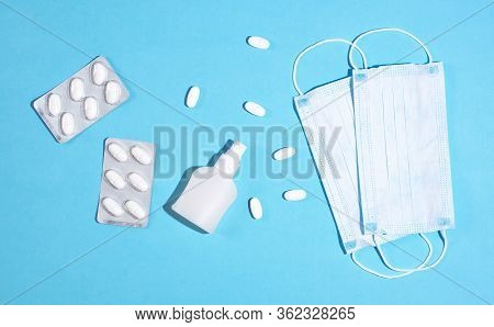 P Revention Of C Oronavirus. Medical Masks, Vitamins, Antiseptic On A Blue Background.