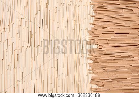Background Of Dry Udon And Soba, Thin Noodles Made From Wheat And Buckwheat Flour Laid Out In Severa