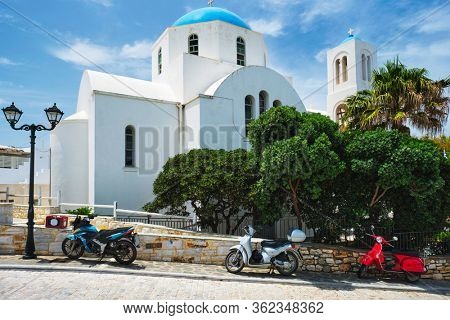 Ttraditional whitewashed orthodox christian church in of Naousa town in famous tourist attraction Paros island, Greece