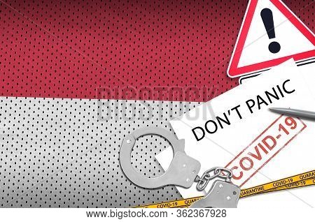 Indonesia Flag And Police Handcuffs With Inscription Dont Panic On White Paper. Coronavirus Or 2019-