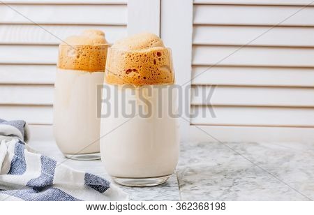 Iced Frothy Dalgona Coffee, A Trendy Fluffy Creamy Whipped Coffee. Korean Drink: Coffee Foam Made Of