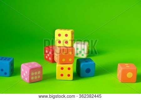 Cube With Numbers.bouncing Dice. Multicolored Cubes Set On A Green Background. Numbers And Symbols. 