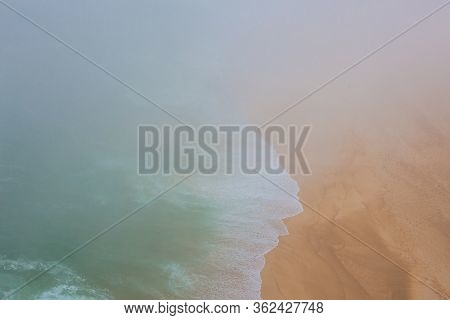 Sea And Sandy Beach In Dense Fog, Autumn Day