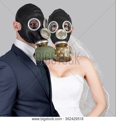 Wedding During The Coronavirus Period. Bride And Groom In Protective Medical Masks