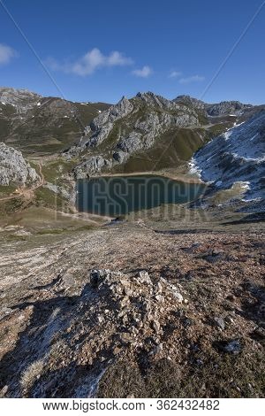 Lago De La Cueva At The End Of Winter, Snowy Areas In The Mountains. Saliencia Lakes In The Somiedo 