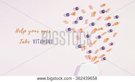 Vitamins And Supplements For Healthy Eyes On Pink Background. How To Maintain Good Vision Concept. B