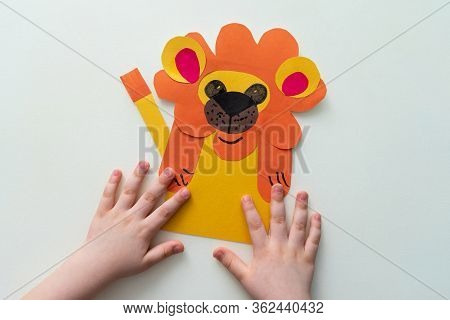 A Child Makes A Lion From Paper And Cardboard. Master Class, Diy, Animals Of Africa, Yellow Color. H