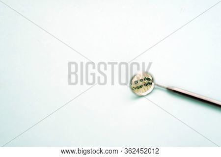 Dental Care Concept, Healthy Jaw With Tooth Model With Dentist Mouth Mirror On Blue Background With 