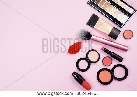 Cosmetics Is On The Pink Backgroud. Makeup In Close View. A Lot Of Cosmetics For Woman On The Backgr