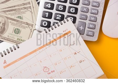 April Of The Year Is Tax Day, Top View Flat Lay Closeup Calculator, Laptop Computer, Calendar, And D