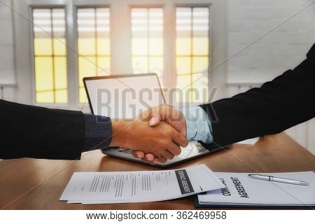 The Lawyer Shook Hands With The Client After Completing The Consultation In The Case.