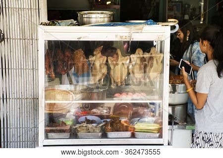 Thai Women People And Travelers Buy Hainanese Chicken Rice Betong Style And Other Food At Local Stre